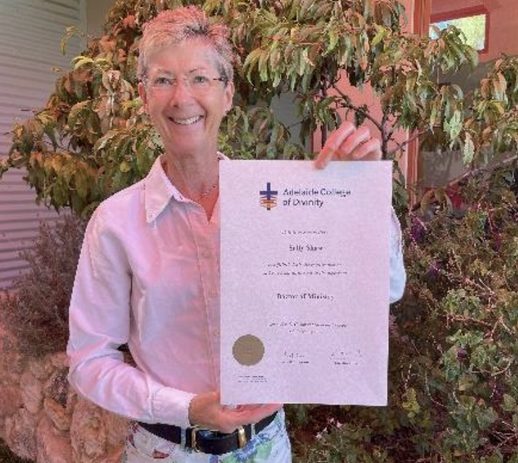 Director Sally Shaw holding Doctor of Ministry Certificate 