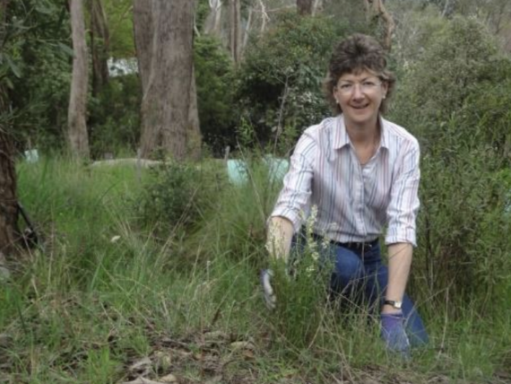 Sally Shaw removing invasive grasses through Creation Care